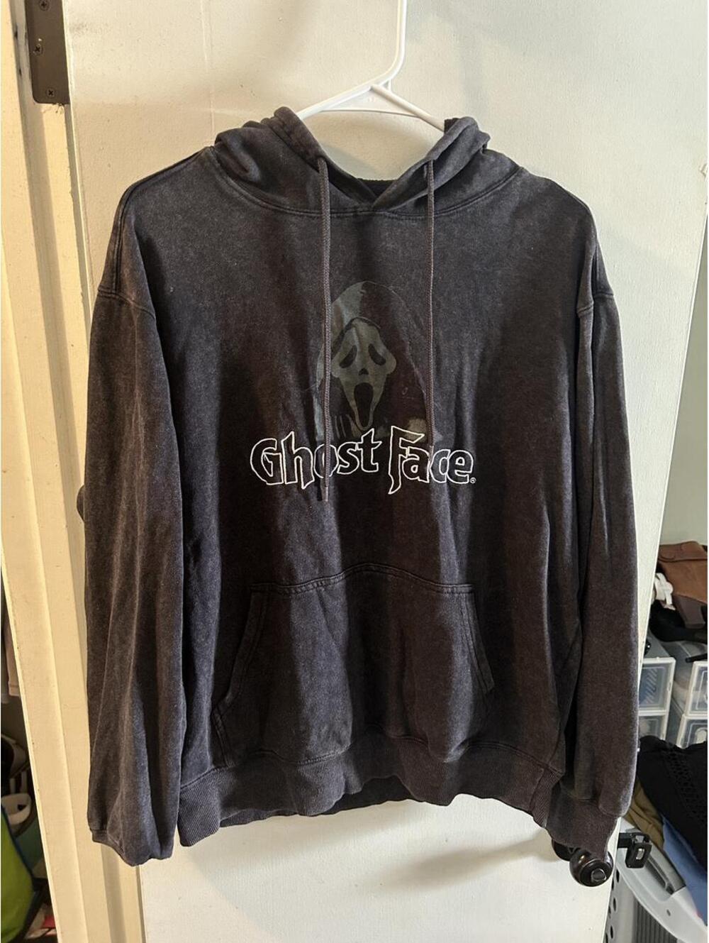 Ghost Face hoodie with white 'Ghost Face' text and ghost graphic, size M.